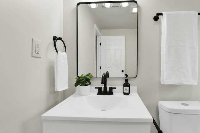 1465 Zenner Dr, Columbus, OH 43207 - half bathroom featuring vanity and toilet