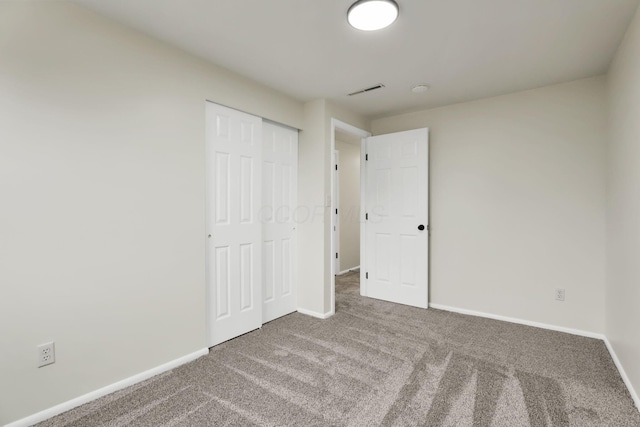 1465 Zenner Dr, Columbus, OH 43207 - unfurnished bedroom featuring carpet floors, baseboards, and a closet