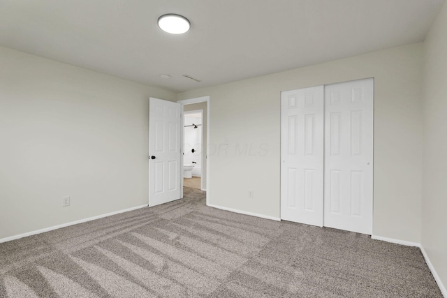 1465 Zenner Dr, Columbus, OH 43207 - unfurnished bedroom featuring carpet floors, baseboards, and a closet