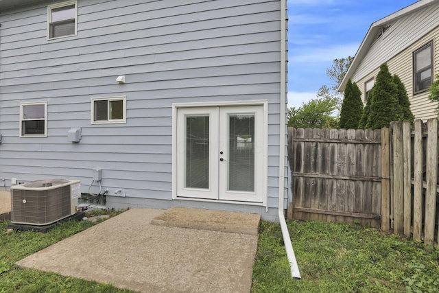 1465 Zenner Dr, Columbus, OH 43207 - back of house with french doors, central AC unit, and a patio area