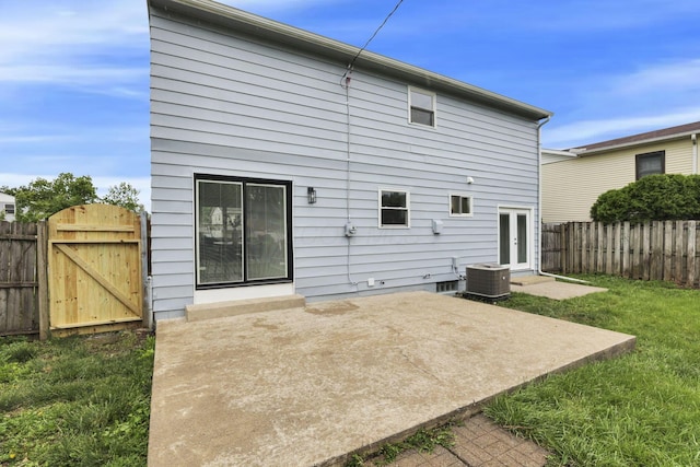 1465 Zenner Dr, Columbus, OH 43207 - rear view of property with a patio, cooling unit, and a gate