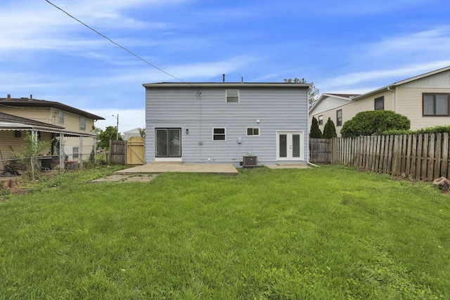 1465 Zenner Dr, Columbus, OH 43207 - rear view of property featuring french doors, cooling unit, and a patio