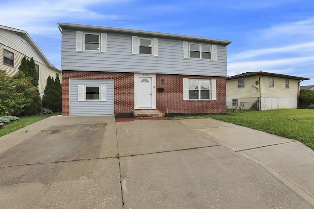 1465 Zenner Dr, Columbus, OH 43207 - colonial inspired home featuring brick siding and a front lawn