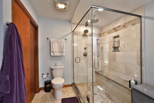 4359 Shire Cove Rd, Hilliard, OH 43026 - full bath featuring tile patterned flooring, a shower stall, toilet, and baseboards