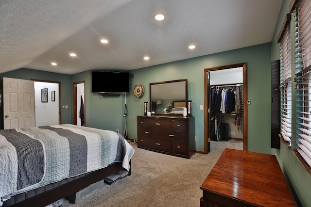 4359 Shire Cove Rd, Hilliard, OH 43026 - bedroom featuring light carpet, a spacious closet, recessed lighting, vaulted ceiling, and a closet