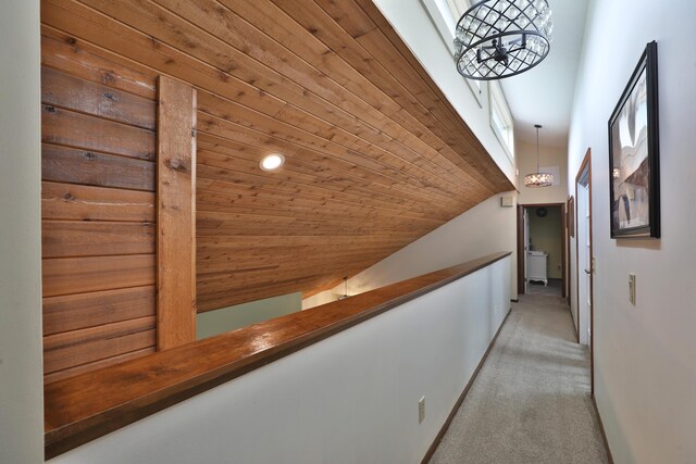 4359 Shire Cove Rd, Hilliard, OH 43026 - hall with a chandelier, carpet floors, wooden ceiling, lofted ceiling, and baseboards