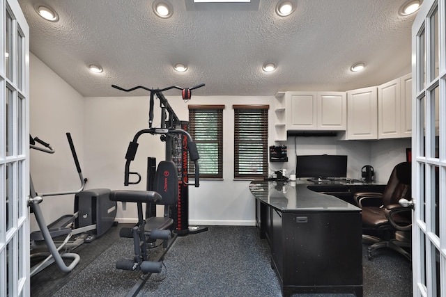 4359 Shire Cove Rd, Hilliard, OH 43026 - exercise room featuring baseboards, a textured ceiling, and french doors