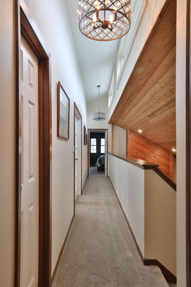 4359 Shire Cove Rd, Hilliard, OH 43026 - corridor featuring a chandelier, light colored carpet, and baseboards