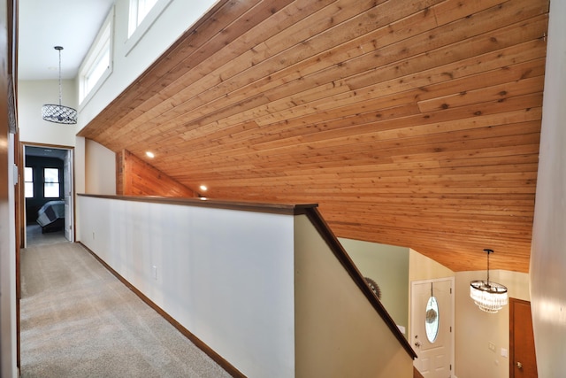 4359 Shire Cove Rd, Hilliard, OH 43026 - hallway featuring wood ceiling, an upstairs landing, light carpet, vaulted ceiling, and baseboards
