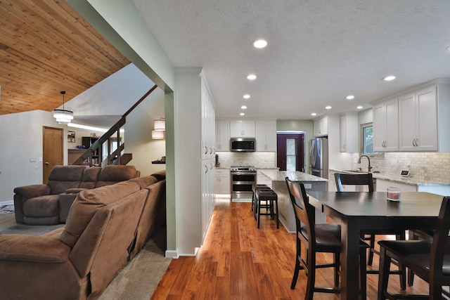 4359 Shire Cove Rd, Hilliard, OH 43026 - dining room featuring recessed lighting, light wood-type flooring, stairway, and baseboards