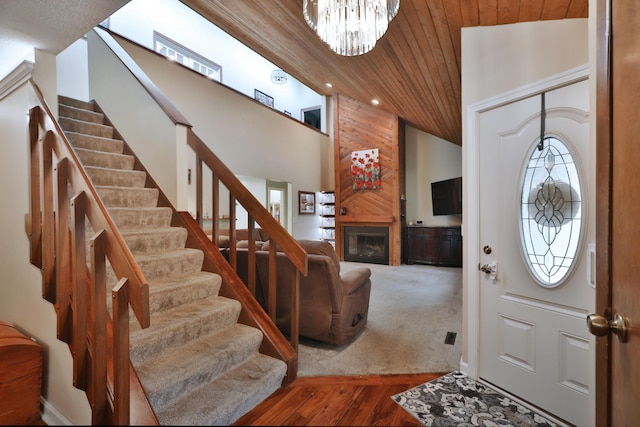 4359 Shire Cove Rd, Hilliard, OH 43026 - foyer featuring stairs, wood ceiling, a large fireplace, a chandelier, and recessed lighting