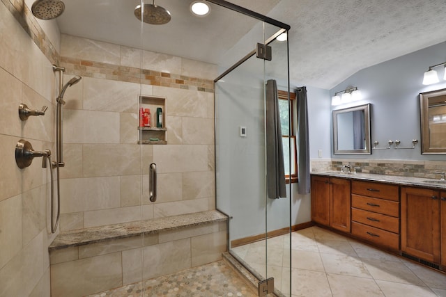 4359 Shire Cove Rd, Hilliard, OH 43026 - full bath featuring a shower stall, double vanity, vaulted ceiling, and a textured ceiling
