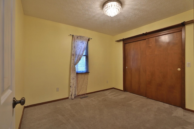 4359 Shire Cove Rd, Hilliard, OH 43026 - unfurnished bedroom with carpet, a textured ceiling, and a closet