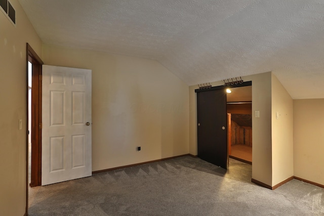 4359 Shire Cove Rd, Hilliard, OH 43026 - additional living space with carpet flooring, a textured ceiling, and vaulted ceiling