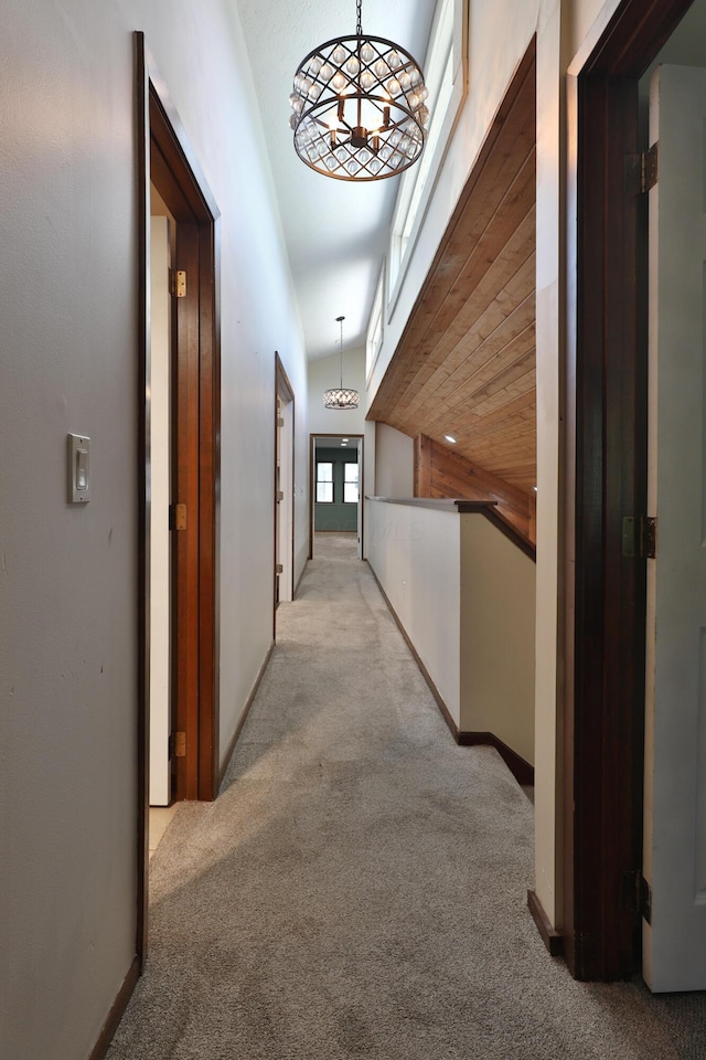 4359 Shire Cove Rd, Hilliard, OH 43026 - hallway featuring light colored carpet and a chandelier