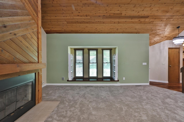 4359 Shire Cove Rd, Hilliard, OH 43026 - unfurnished living room featuring lofted ceiling, carpet floors, wood ceiling, a fireplace with flush hearth, and a chandelier