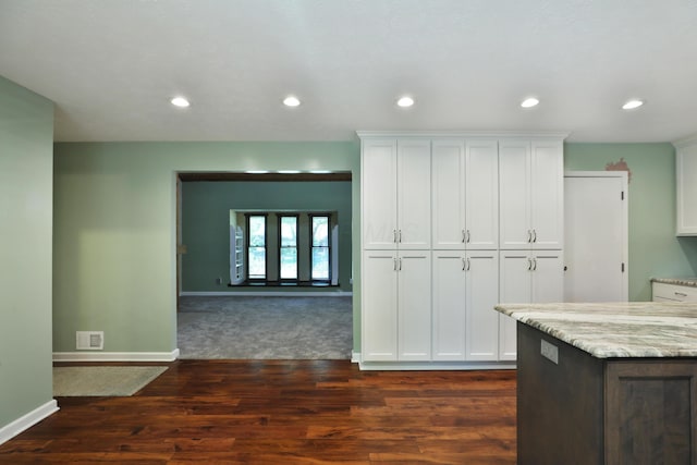 4359 Shire Cove Rd, Hilliard, OH 43026 - kitchen with light stone counters, white cabinetry, dark wood-type flooring, and recessed lighting