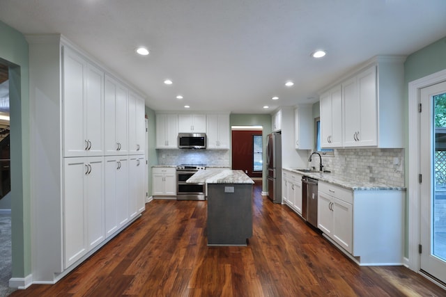 4359 Shire Cove Rd, Hilliard, OH 43026 - kitchen featuring stainless steel appliances, white cabinets, tasteful backsplash, dark wood-style flooring, and recessed lighting