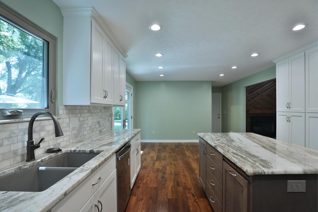 4359 Shire Cove Rd, Hilliard, OH 43026 - kitchen with stainless steel dishwasher, recessed lighting, plenty of natural light, and white cabinets