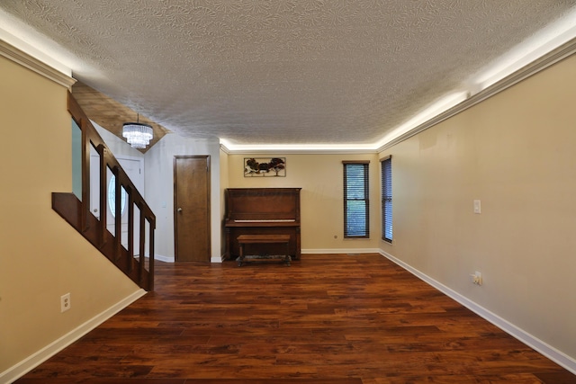 4359 Shire Cove Rd, Hilliard, OH 43026 - unfurnished living room with a textured ceiling, a chandelier, wood finished floors, and stairs
