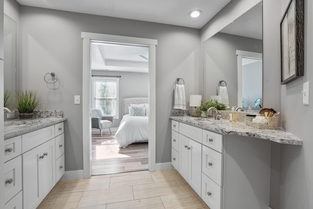 107 Willows End, Bellefontaine, OH 43311 - full bathroom featuring ensuite bath, two vanities, and baseboards