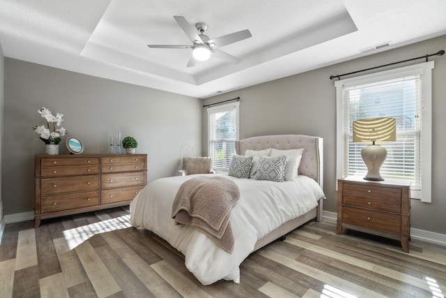 107 Willows End, Bellefontaine, OH 43311 - bedroom featuring a raised ceiling, wood finished floors, baseboards, and ceiling fan