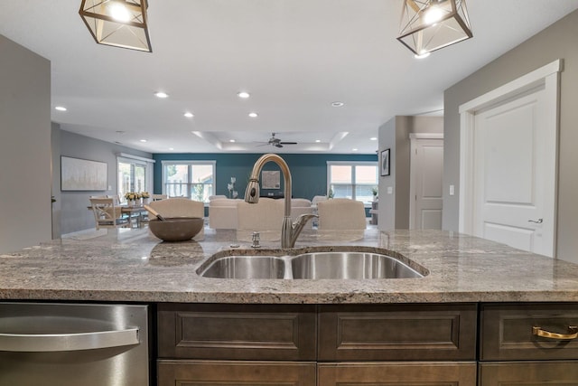 107 Willows End, Bellefontaine, OH 43311 - kitchen featuring open floor plan, a sink, dark brown cabinetry, light stone counters, and recessed lighting