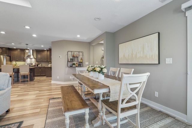 107 Willows End, Bellefontaine, OH 43311 - dining room featuring recessed lighting, light wood finished floors, and baseboards