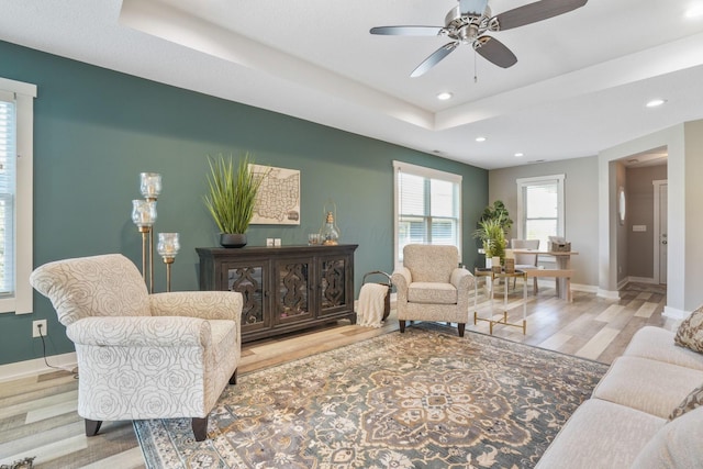 107 Willows End, Bellefontaine, OH 43311 - living room featuring wood finished floors, ceiling fan, baseboards, recessed lighting, and a raised ceiling