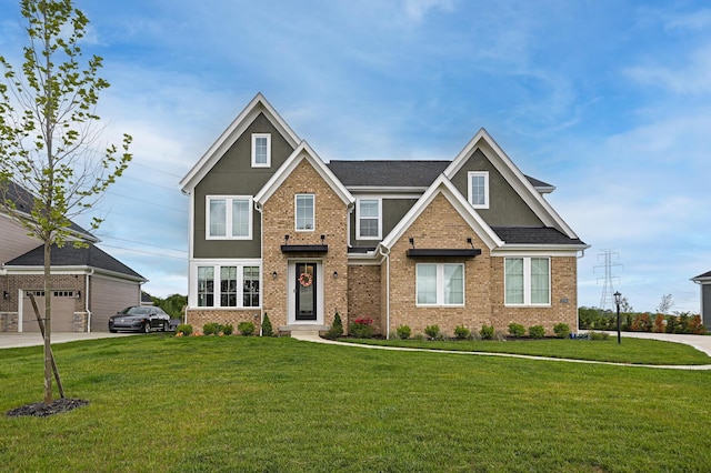 2733 Sycamore Trce, Hilliard, OH 43026 - view of front of house with a front yard, brick siding, stucco siding, and roof with shingles