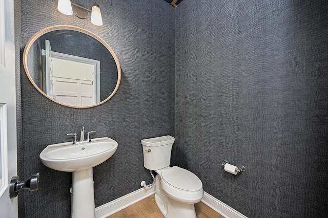 2733 Sycamore Trce, Hilliard, OH 43026 - half bathroom featuring wood finished floors, toilet, and baseboards