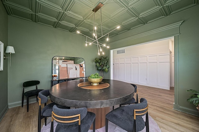 2733 Sycamore Trce, Hilliard, OH 43026 - dining space featuring an ornate ceiling, wood finished floors, baseboards, and a chandelier