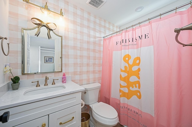 2733 Sycamore Trce, Hilliard, OH 43026 - bathroom with wallpapered walls, toilet, vanity, and curtained shower