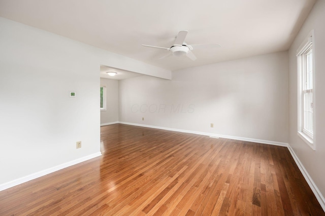 1609 Slade Ave, Columbus, OH 43235 - empty room with light wood finished floors, baseboards, and a ceiling fan