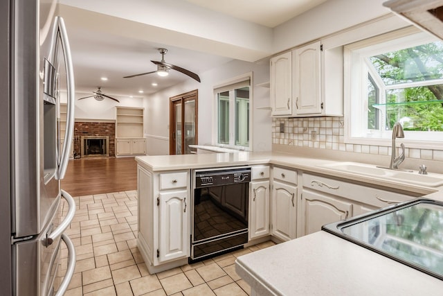 1609 Slade Ave, Columbus, OH 43235 - kitchen with black appliances, a sink, open floor plan, a peninsula, and a ceiling fan
