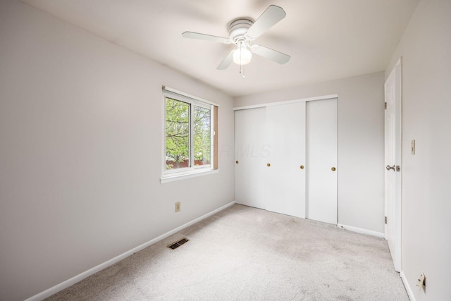 1609 Slade Ave, Columbus, OH 43235 - unfurnished bedroom with light carpet, baseboards, a closet, and ceiling fan
