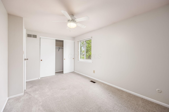1609 Slade Ave, Columbus, OH 43235 - unfurnished bedroom with carpet flooring, baseboards, a closet, and a ceiling fan