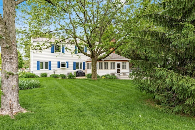 1609 Slade Ave, Columbus, OH 43235 - rear view of property featuring a lawn and a patio