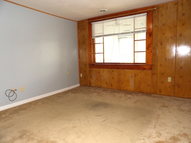 938 Meadowview Ave, Lancaster, OH 43130 - spare room featuring wooden walls, baseboards, and concrete floors