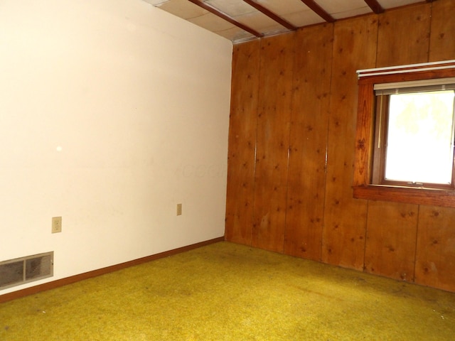 938 Meadowview Ave, Lancaster, OH 43130 - spare room featuring carpet, wood walls, and baseboards