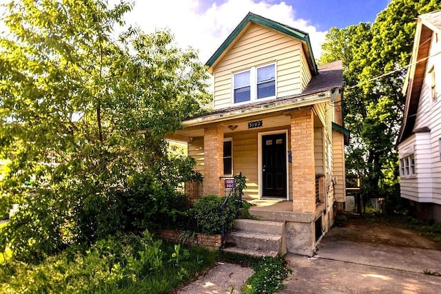 3102 Lehman Rd, Cincinnati, OH 45204 - view of front of house with covered porch and roof with shingles