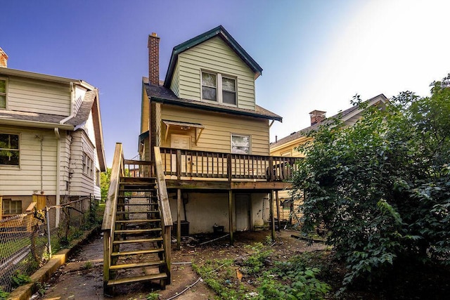 3102 Lehman Rd, Cincinnati, OH 45204 - rear view of property featuring stairway, a deck, and a chimney