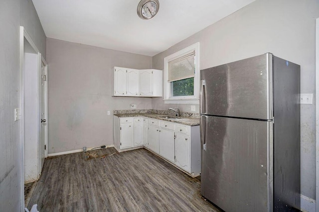 3102 Lehman Rd, Cincinnati, OH 45204 - kitchen featuring freestanding refrigerator, a sink, white cabinetry, and dark wood-style flooring
