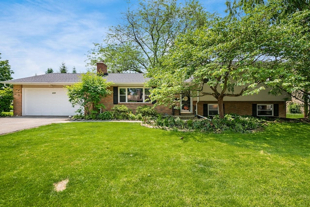 2175 Ridgeview Rd, Upper Arlington, OH 43221 - view of front of home featuring brick siding, driveway, a front lawn, and an attached garage