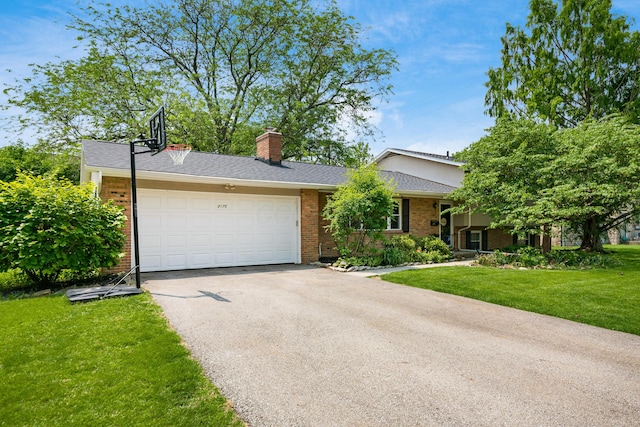 2175 Ridgeview Rd, Upper Arlington, OH 43221 - ranch-style home with driveway, brick siding, a front yard, and an attached garage