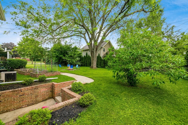 2175 Ridgeview Rd, Upper Arlington, OH 43221 - view of grassy yard with central AC unit and a garden
