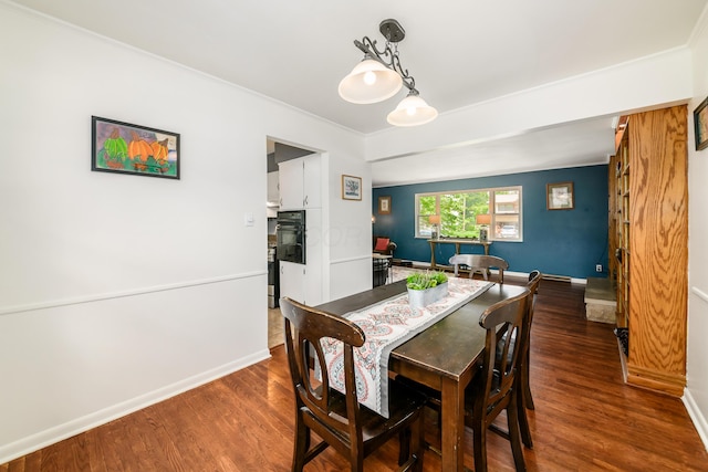 2175 Ridgeview Rd, Upper Arlington, OH 43221 - dining room featuring wood finished floors, crown molding, and baseboards