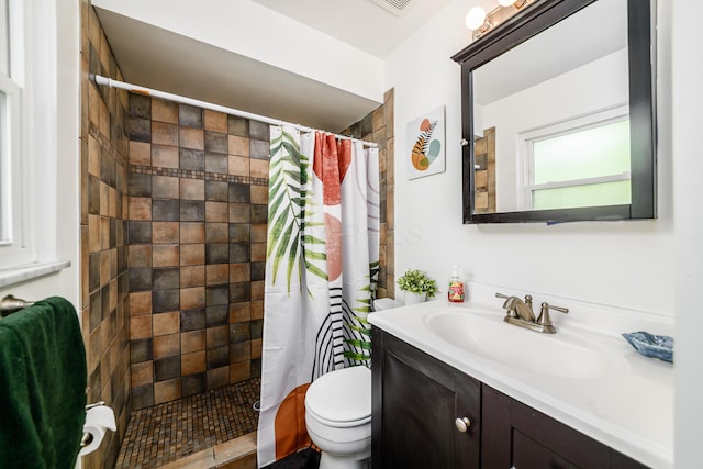 2175 Ridgeview Rd, Upper Arlington, OH 43221 - bathroom featuring toilet, vanity, and a tile shower