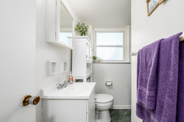 2175 Ridgeview Rd, Upper Arlington, OH 43221 - bathroom featuring vanity, toilet, baseboards, and tile patterned flooring