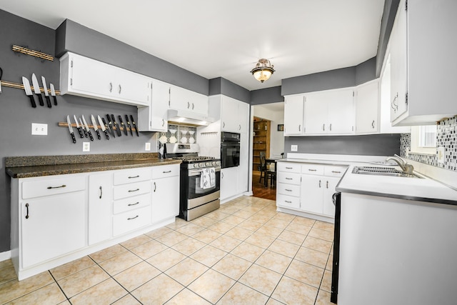 2175 Ridgeview Rd, Upper Arlington, OH 43221 - kitchen with stainless steel range with gas cooktop, black oven, a sink, under cabinet range hood, and light tile patterned floors